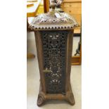 A 20thC cast iron tower design stove  31"h