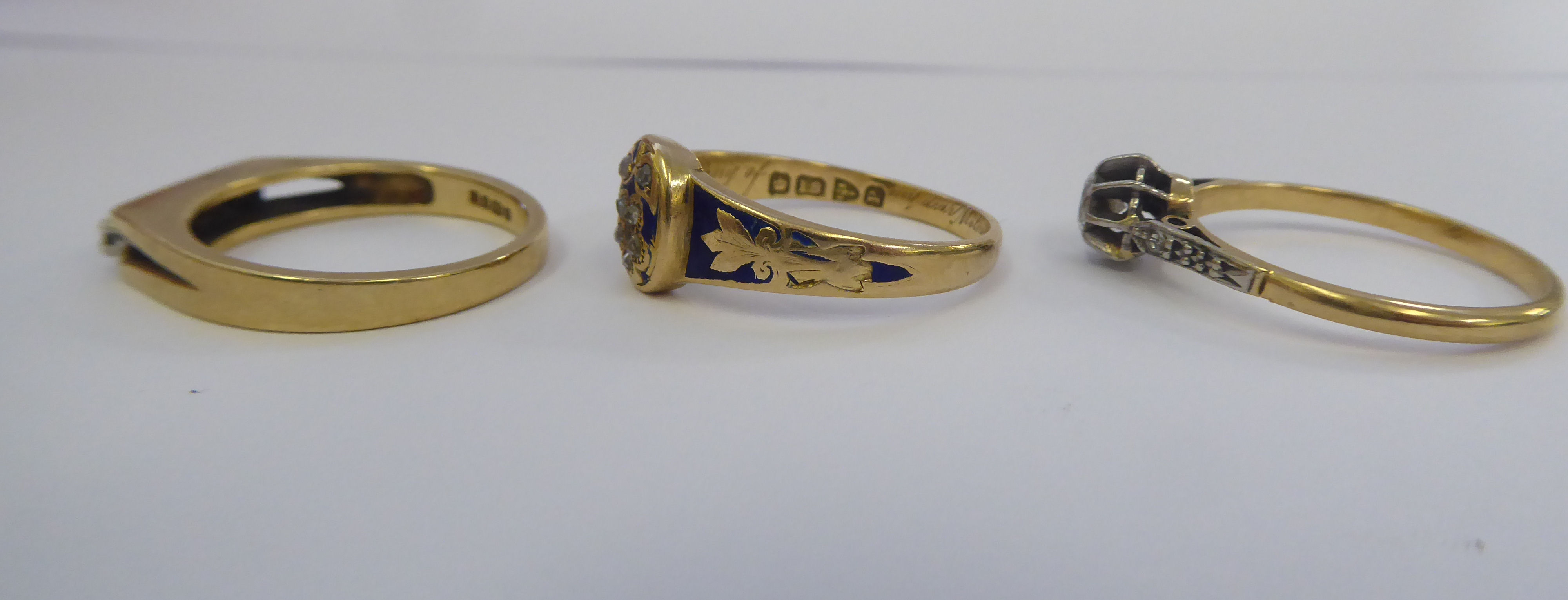 A late Victorian 18ct gold and blue enamel mourning ring; an 18ct gold claw set diamond ring; and - Image 3 of 3