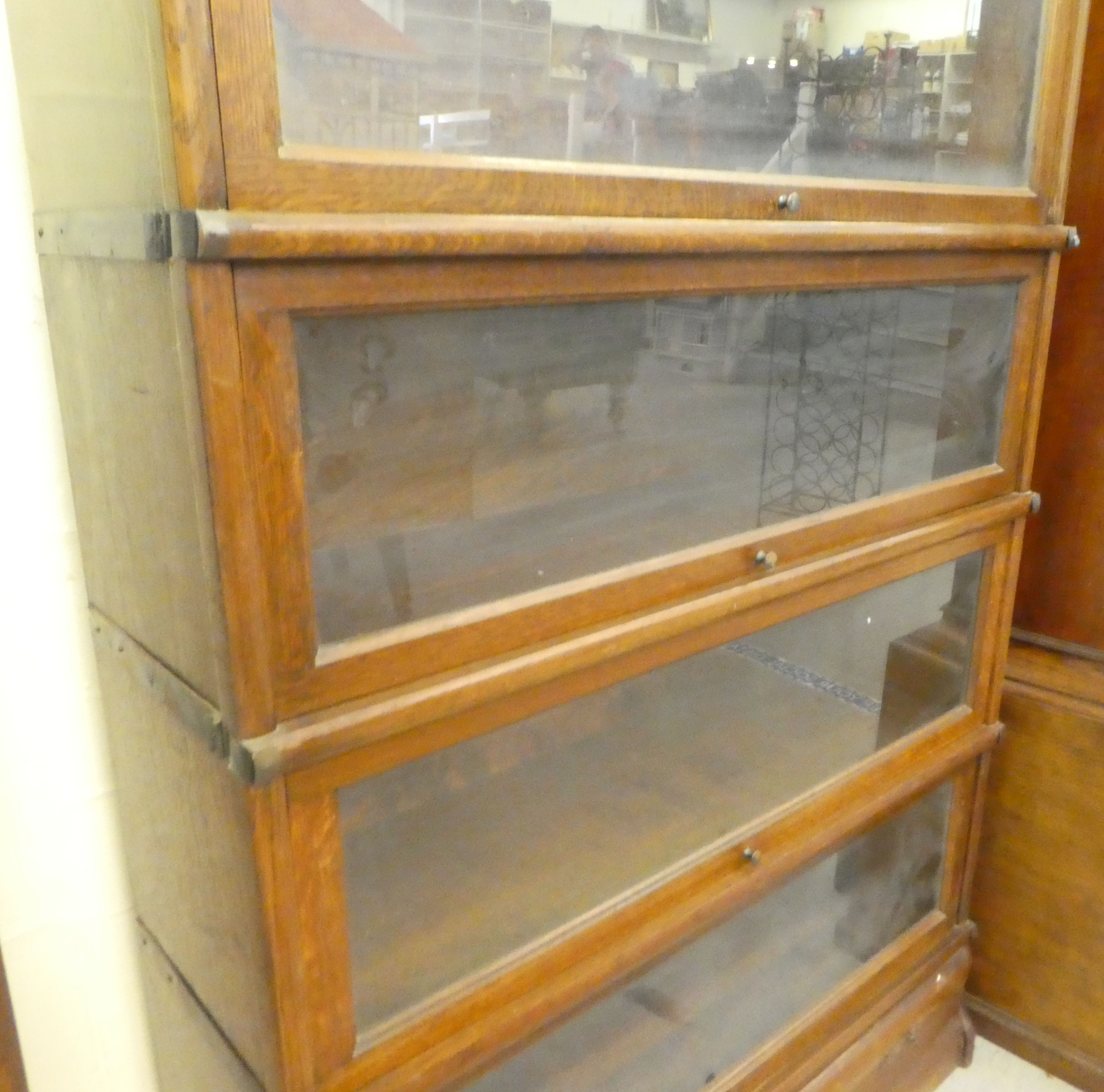 A 1920s/30s oak Globe Wernicke four section bookcase with lift and slide doors and a base drawer, on - Image 4 of 4