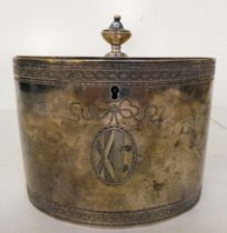 A George III silver oval tea caddy with bright cut engraved frieze ornament, a ribbon tied