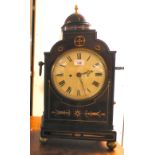 A Regency brass inlaid mahogany director's bracket clock with a domed top and opposing cast metal