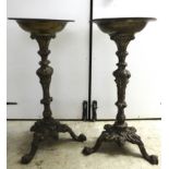 A pair of modern 19thC design cast metal torcheres, on splayed tripod bases  29"h