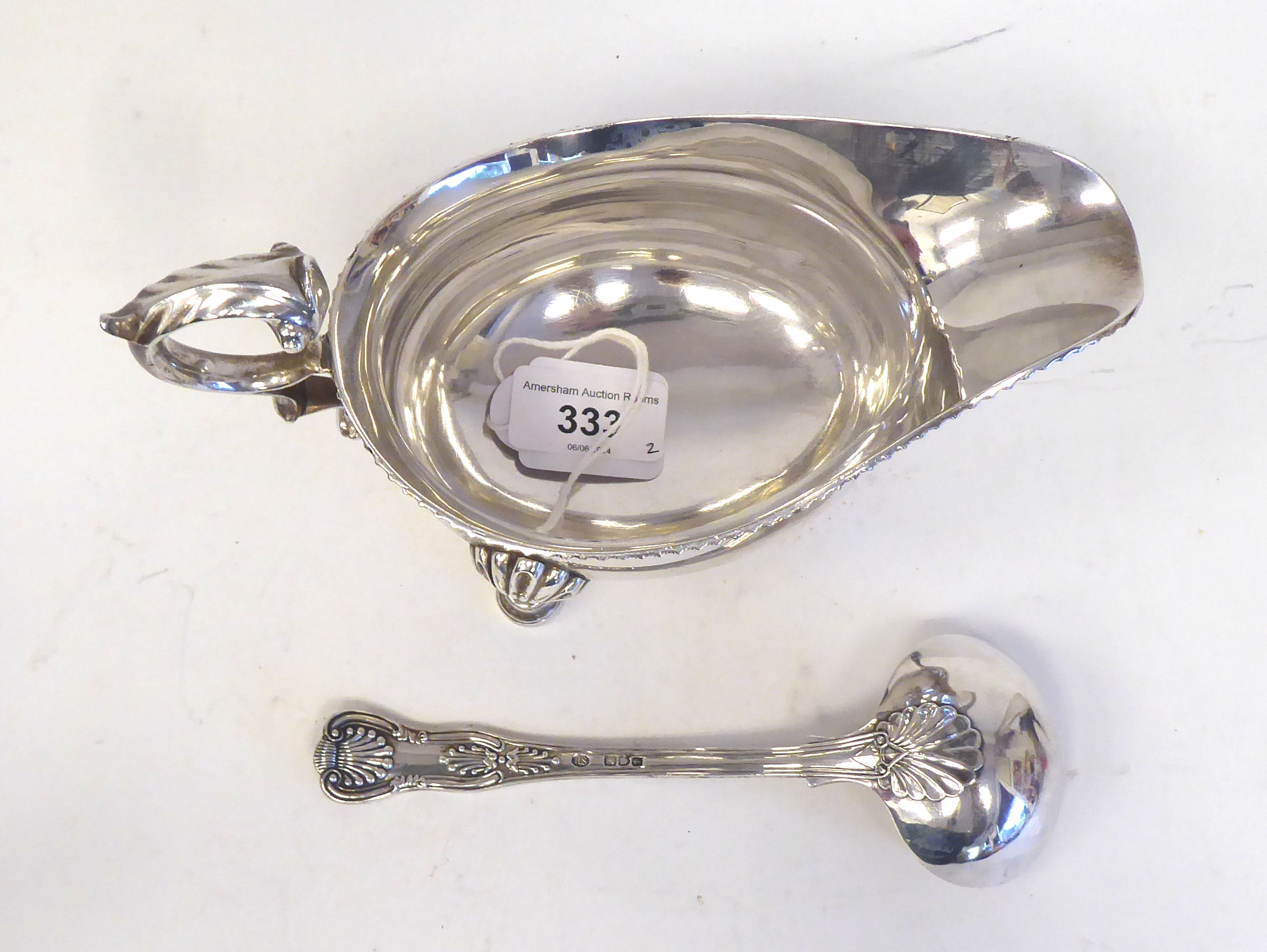 An Edwardian silver sauce boat with a gadrooned border and double S-scrolled handle, elevated on - Image 2 of 5