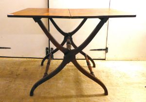 A mid/late 19thC mahogany coaching table, raised on a folding, crossover, turned underframe  28"h