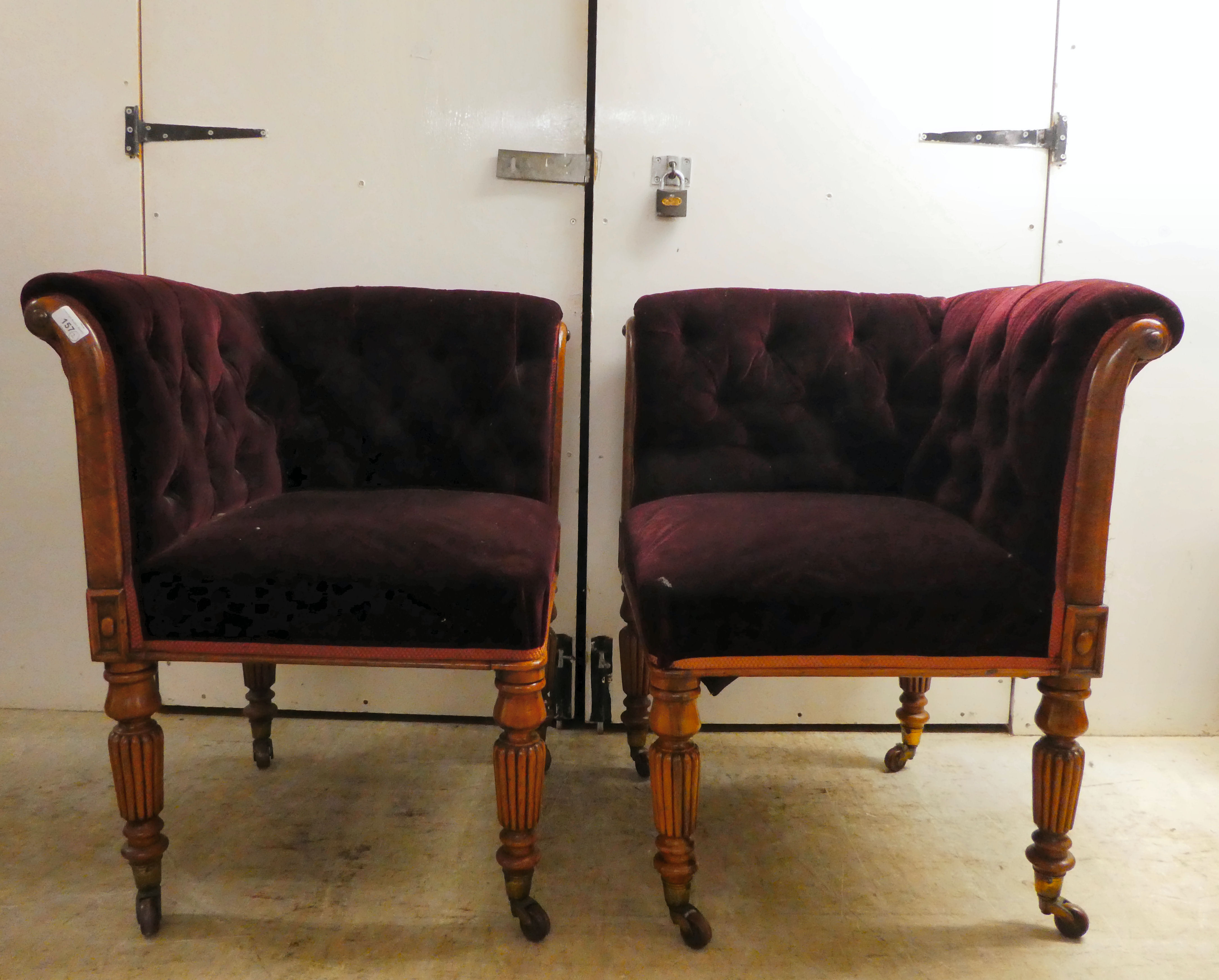 A pair of late Regency walnut showwood framed salon corner chairs, later part button upholstered