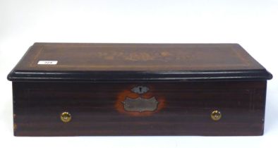 A late Victorian music box, the part ebonised and rosewood finished case with marquetry ornament