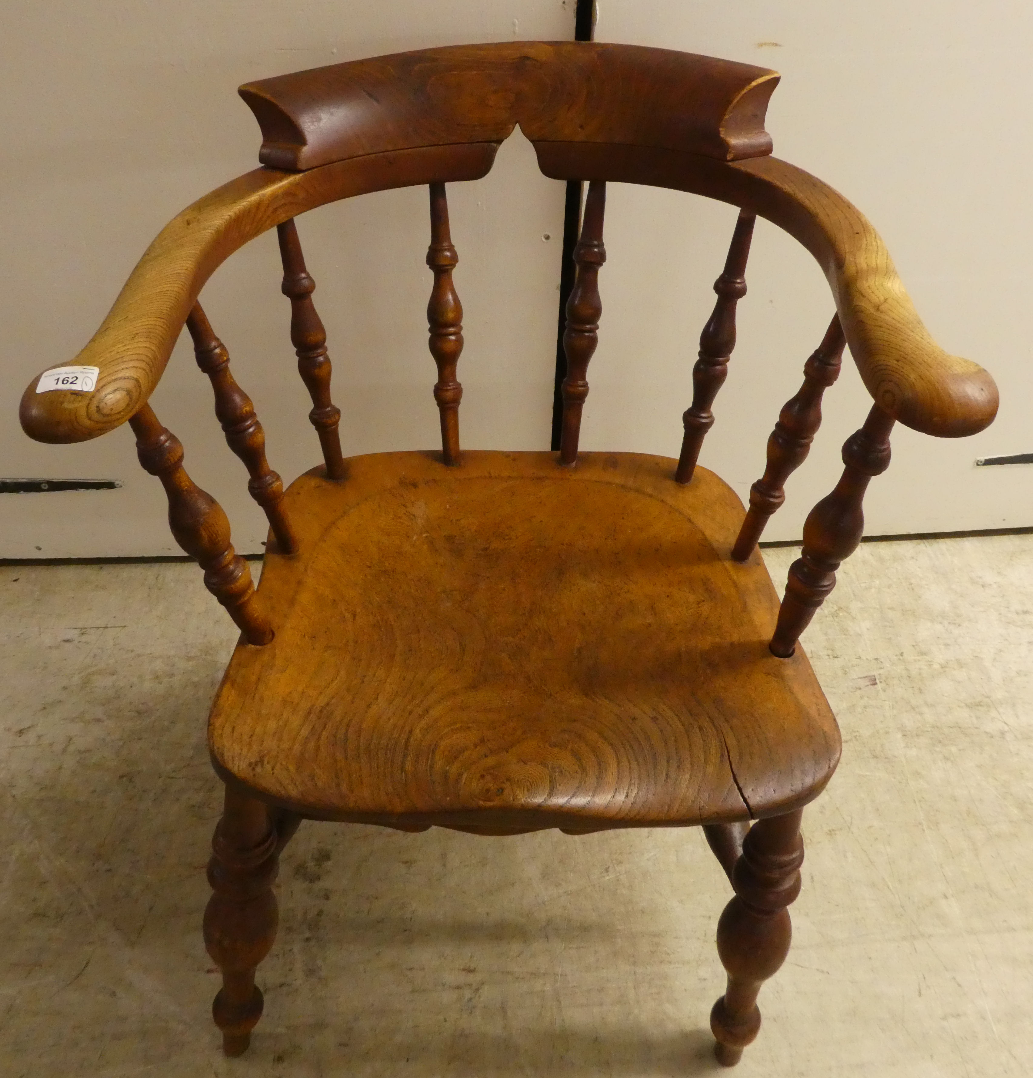 An early 20thC beech and elm framed captain's design desk chair, the solid seat raised on turned - Image 2 of 5