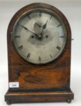 An early 19thC satinwood string inlaid rosewood cased, round top bracket clock with cast gilt metal,