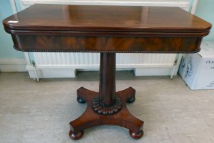 A William IV mahogany tea table, the D-shape foldover top with a deep frieze and bead carved