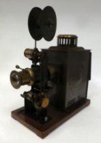 An Edwardian Magic Lantern design, painted tinplate steel and brass, crank operated projector with a