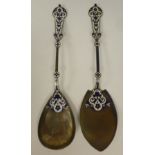 A Continental silver coloured metal and dark blue and white enamel serving spoon and slice