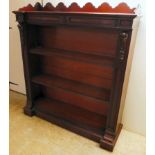 A late Victorian mahogany inverted breakfront bookcase with two height adjustable shelves, on a