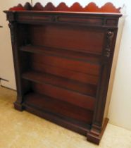 A late Victorian mahogany inverted breakfront bookcase with two height adjustable shelves, on a