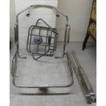 A Lambretta chromium plated tubular steel luggage rack, two pieces of trim; and another in grey