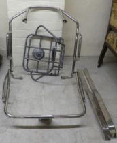 A Lambretta chromium plated tubular steel luggage rack, two pieces of trim; and another in grey