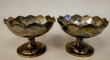 A pair of silver pedestal sweet dishes with impressed diamond formation decoration and applied