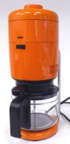 A vintage 1970s Braun KF20 Aromaster coffee maker in orange and black To be sold for decorative