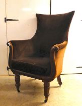 A William IV mahogany showwood framed library chair with a lyre shaped front, later upholstered in