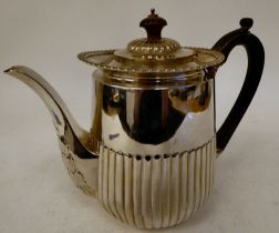 A late Victorian silver coffee pot of tapered demi-reeded, round form with a swept spout,