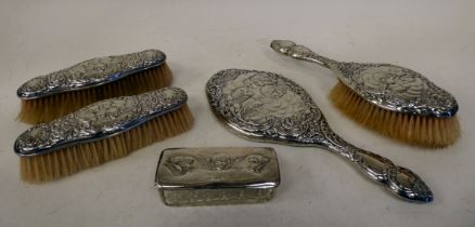 A set of four silver backed dressing table items  comprising a pair of clothes brushes, a hair brush