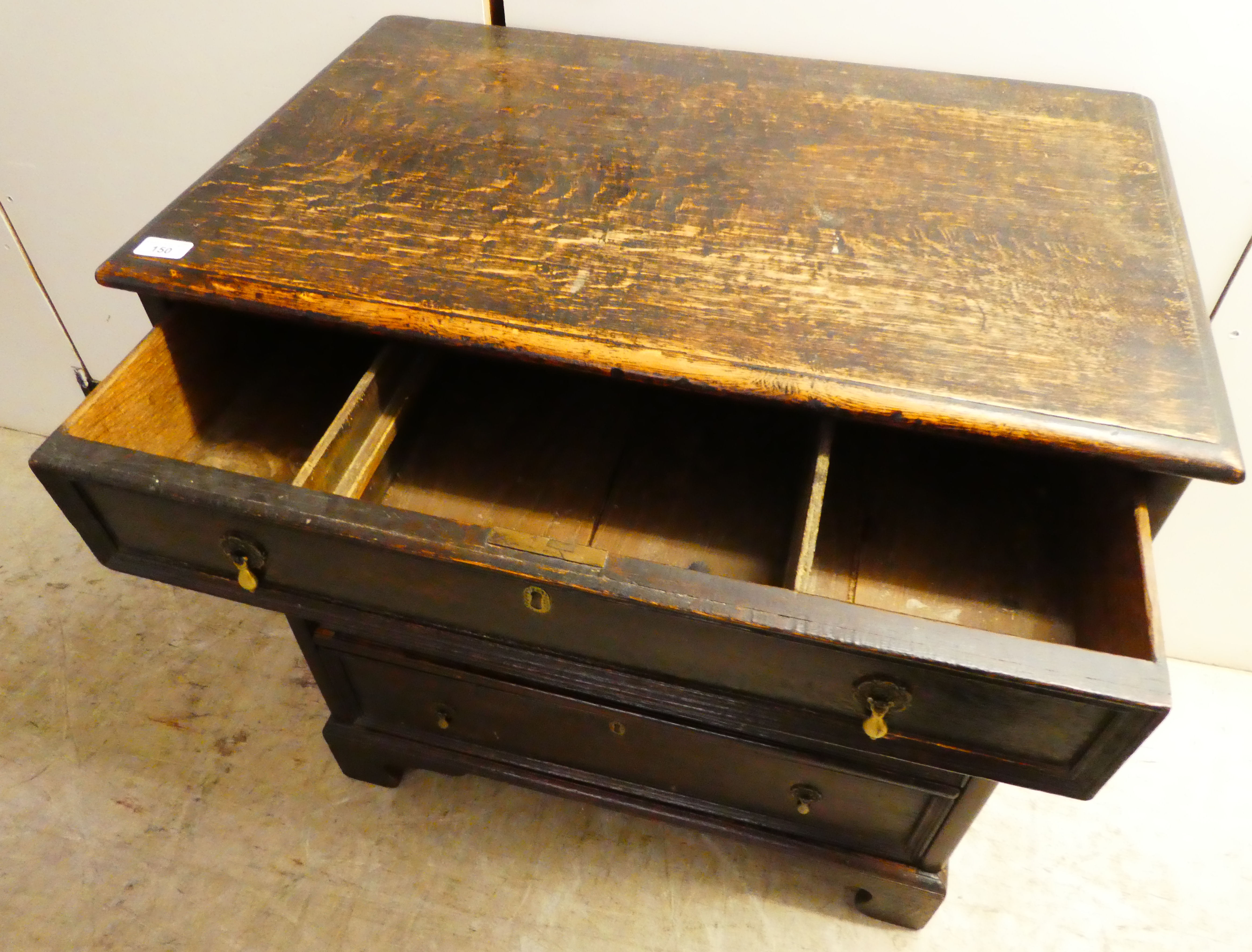 An early 19thC stained oak dressing chest with graduated four drawers, raised on bracket feet  31"h - Image 4 of 4