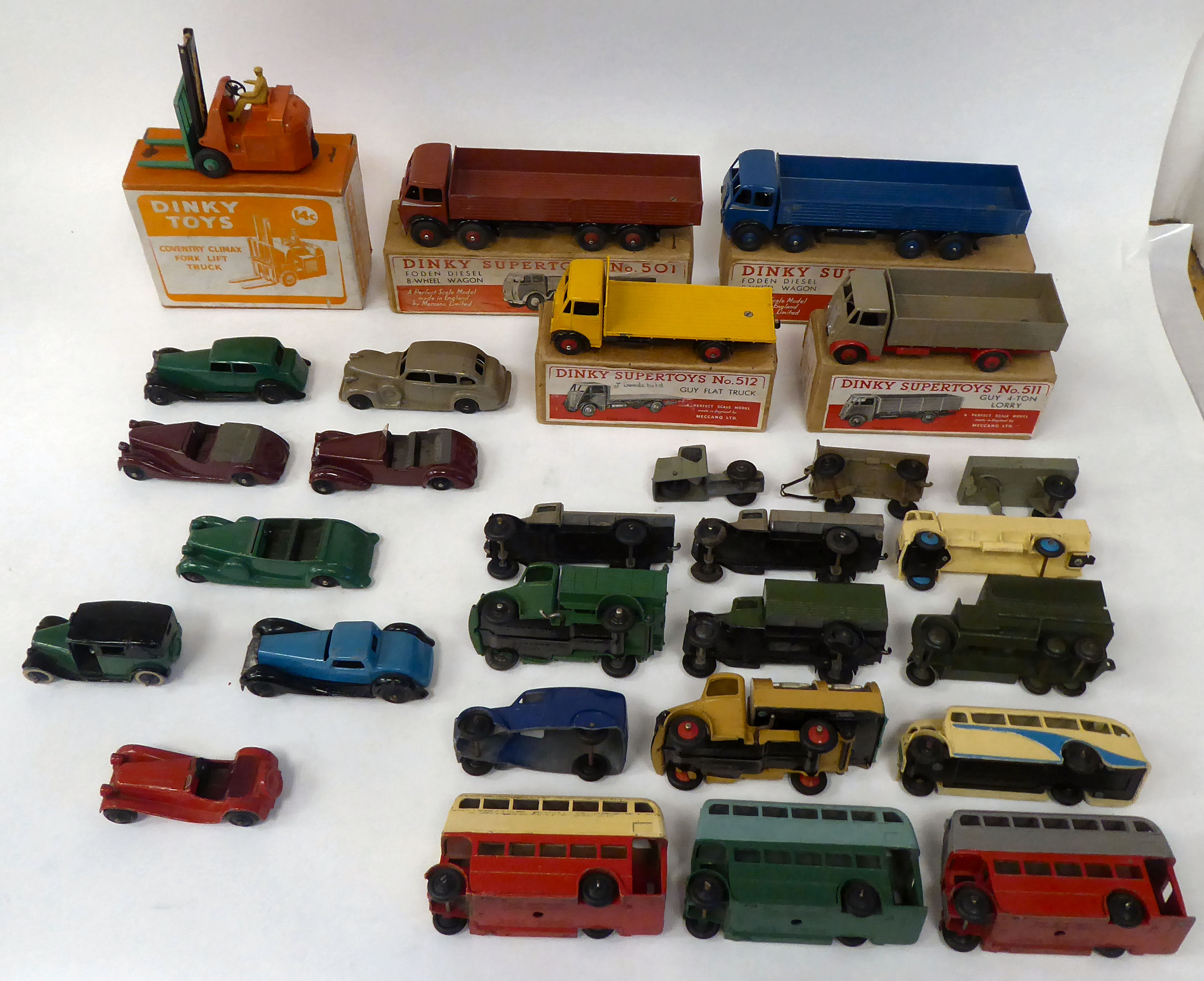 Twenty five vintage Dinky painted diecast model vehicles, some boxed: to include a Guy 4 ton