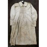 A Continental artisan's brown pleated calico dress with decorative smocking