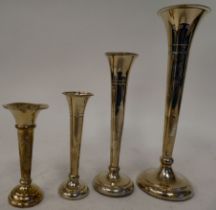 Four similar loaded silver trumpet design specimen vases with serrated rims  mixed marks  largest