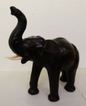 A Liberty's inspired, moulded and stained leather model, a trumpeting elephant  21"h