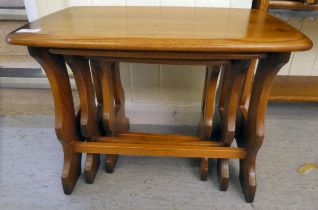 A nesting set of three Ercol Golden Dawn beech and elm, trestle end coffee tables  largest 17"h