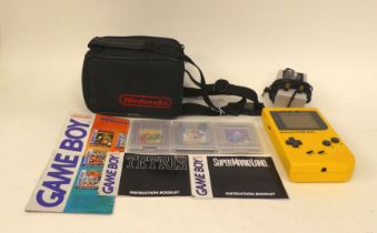 A Nintendo Game Boy with various games, in a soft carrying pouch
