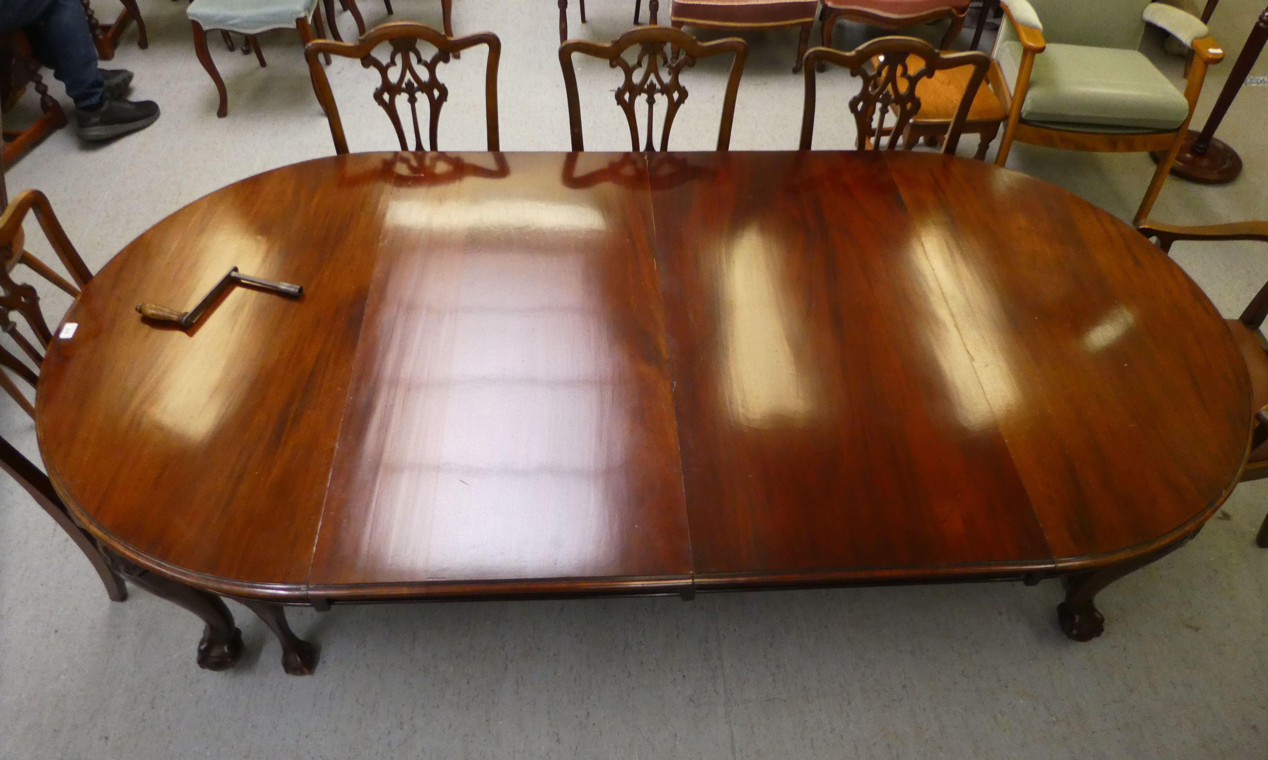 A 1920s mahogany wind-out dining table, raised on cabriole legs, talon and ball feet  29"h  46"L - Image 2 of 5