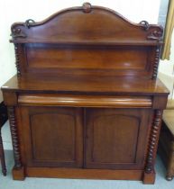 A late Victorian mahogany chiffonier with a panelled back and barleytwist uprights, a frieze
