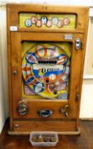 A vintage penny-in-the-slot, mechanical 'Playball' bagatelle machine, in a wall mountable light