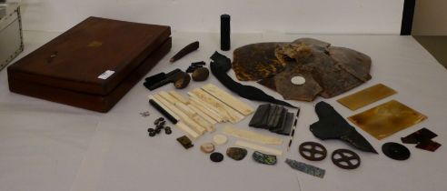 A box of restoration materials: to include fragments of tortoiseshell, bone and mother-of-pearl