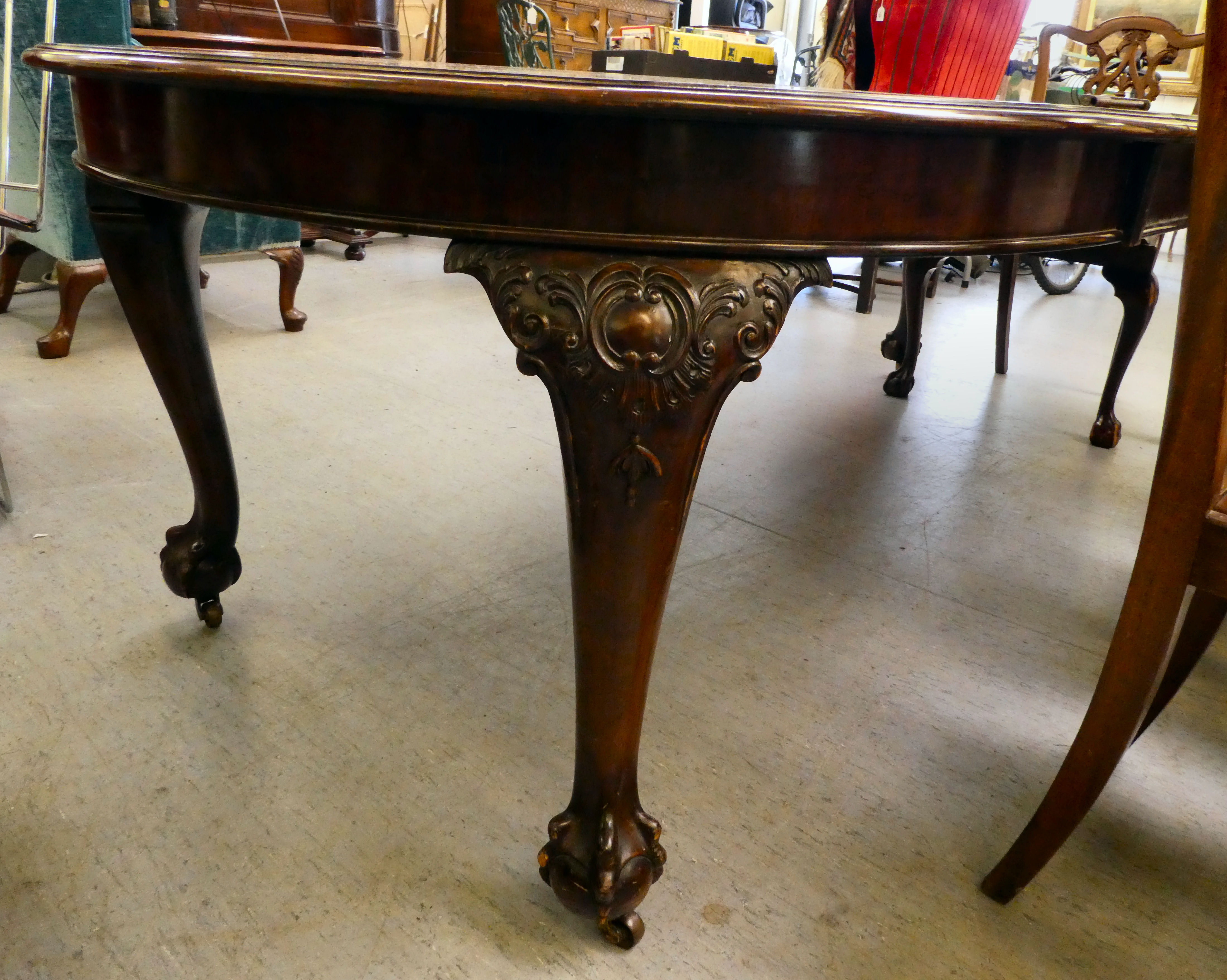 A 1920s mahogany wind-out dining table, raised on cabriole legs, talon and ball feet  29"h  46"L - Image 5 of 5