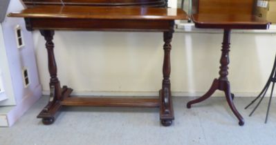 A 20thC mahogany single drawer side table, raised on turned baluster supports, united by a