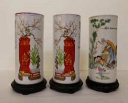 A set of three 20thC Chinese porcelain cylindrical vases, decorated with figures, ornaments and