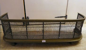 A late Victorian brass and wire mesh fire curb  40"w