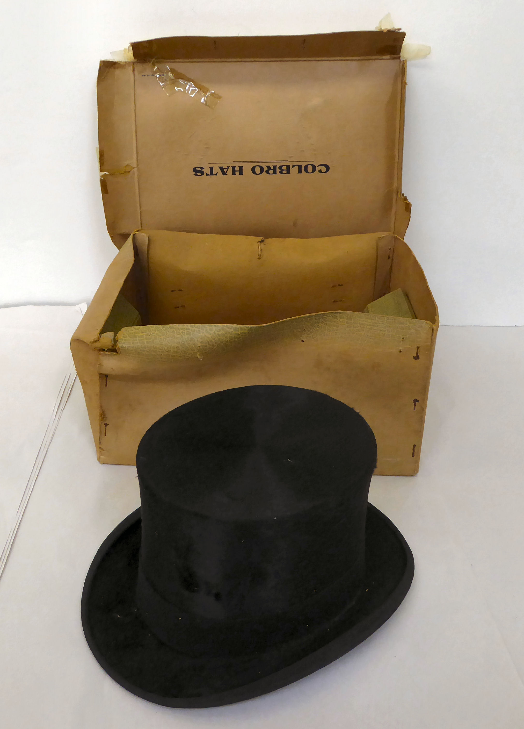 An Alberts of London black silk top hat