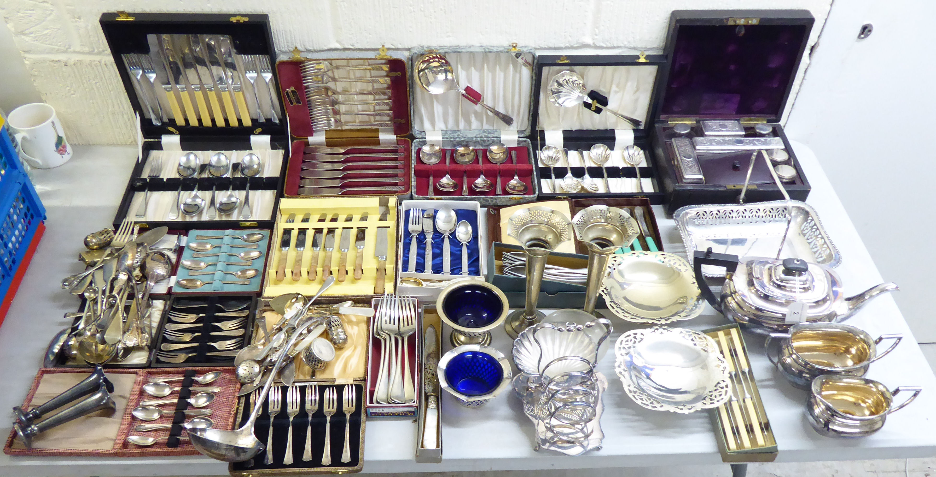 Mainly silver plated tableware: to include a three piece tea set; serving items; and a vanity