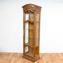 A French provincial oak display cabinet of narrow form