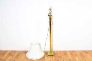 A classical style brass standard lamp in the form of a Corinthian column