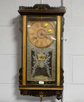 An American ebonised wood wall clock, by Ansonia Clock Co