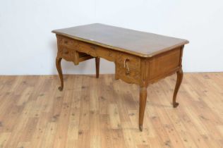 A French-style oak serpentine fronted writing desk