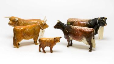 A collection of Beswick ceramic figures of cows