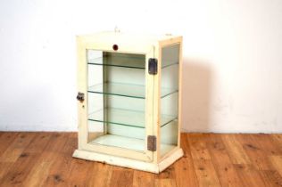 A vintage glazed dentists cabinet by Allen & Hanbury Ltd