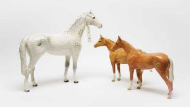 A Beswick figure of a standing dapple-grey horse