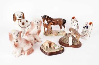 A pair of Staffordshire Wally dogs and a selection of ceramic figurines