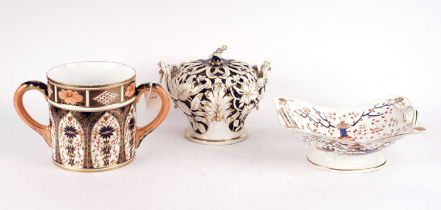 A Royal Crown Derby Imari twin handled loving cup, a Derby basket comport, and a bowl and cover